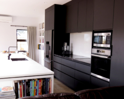 Our client wanted a very minimal kitchen with only Black and White elements. We used Matt Black Laminex Acrylic cabinetry offset with Gloss White Acrylic on the Island bench.