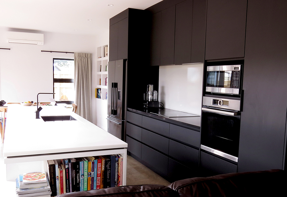 Our client wanted a very minimal kitchen with only Black and White elements. We used Matt Black Laminex Acrylic cabinetry offset with Gloss White Acrylic on the Island bench.